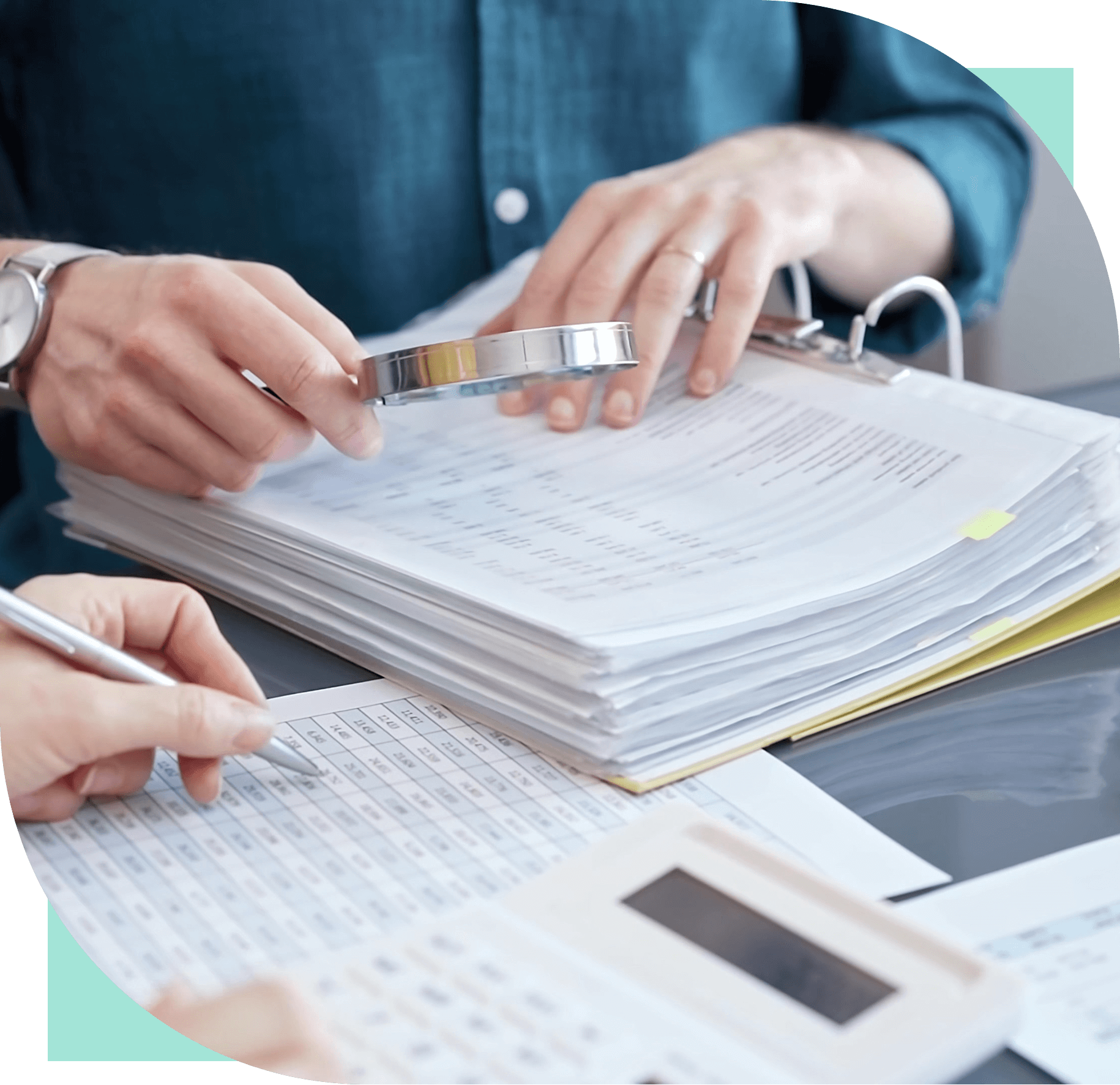 Reviewing documents with a magnifying glass.
